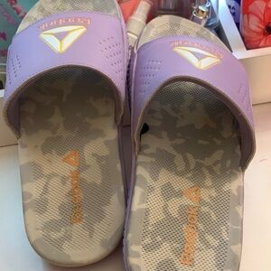 I am selling Reebok slides in good condition